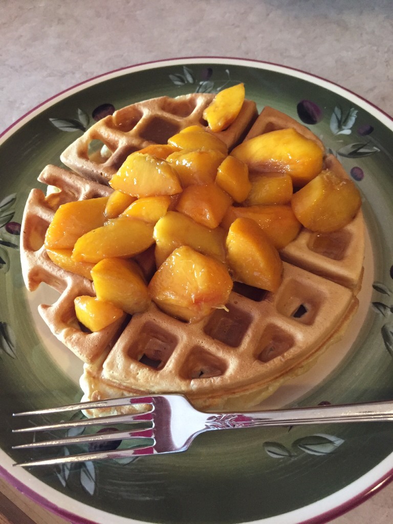 Waffles topped with peaches