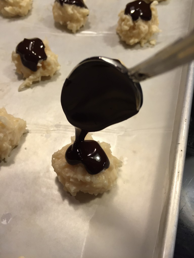 Top each cookie with melted chocolate.