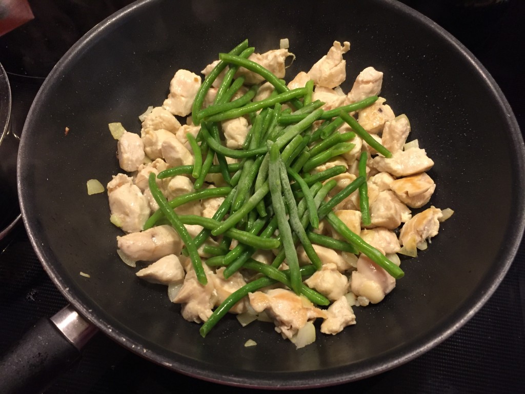 add chicken and green beans to the wok