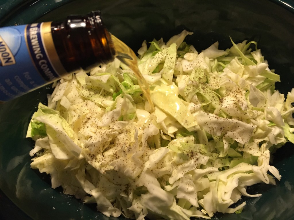 Add beer to the slow-cooker.