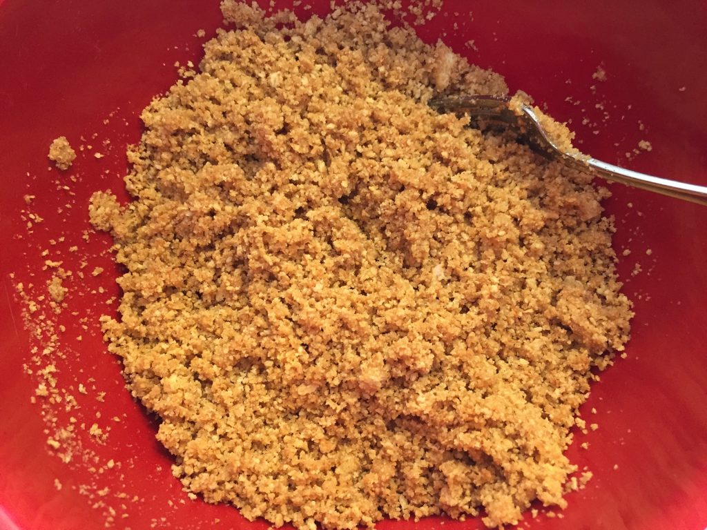 Combine graham cracker crumbs, butter and sugar for the crust.