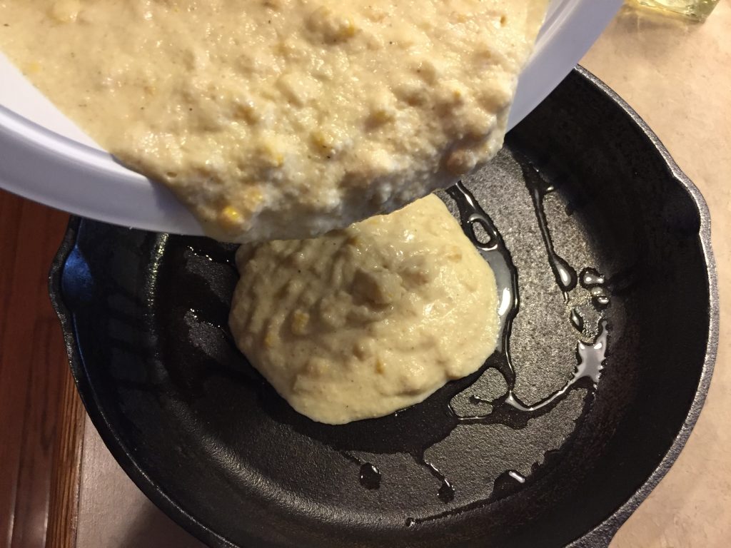 Pour cornbread mixture into skillet.