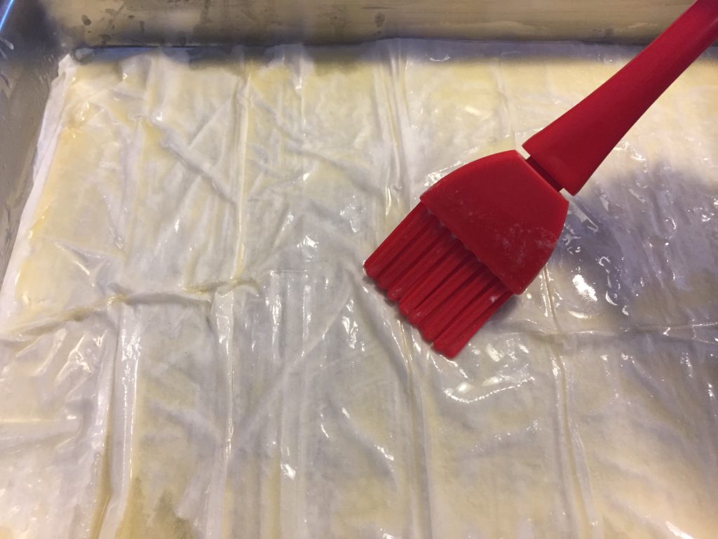 Brush the dough with butter.