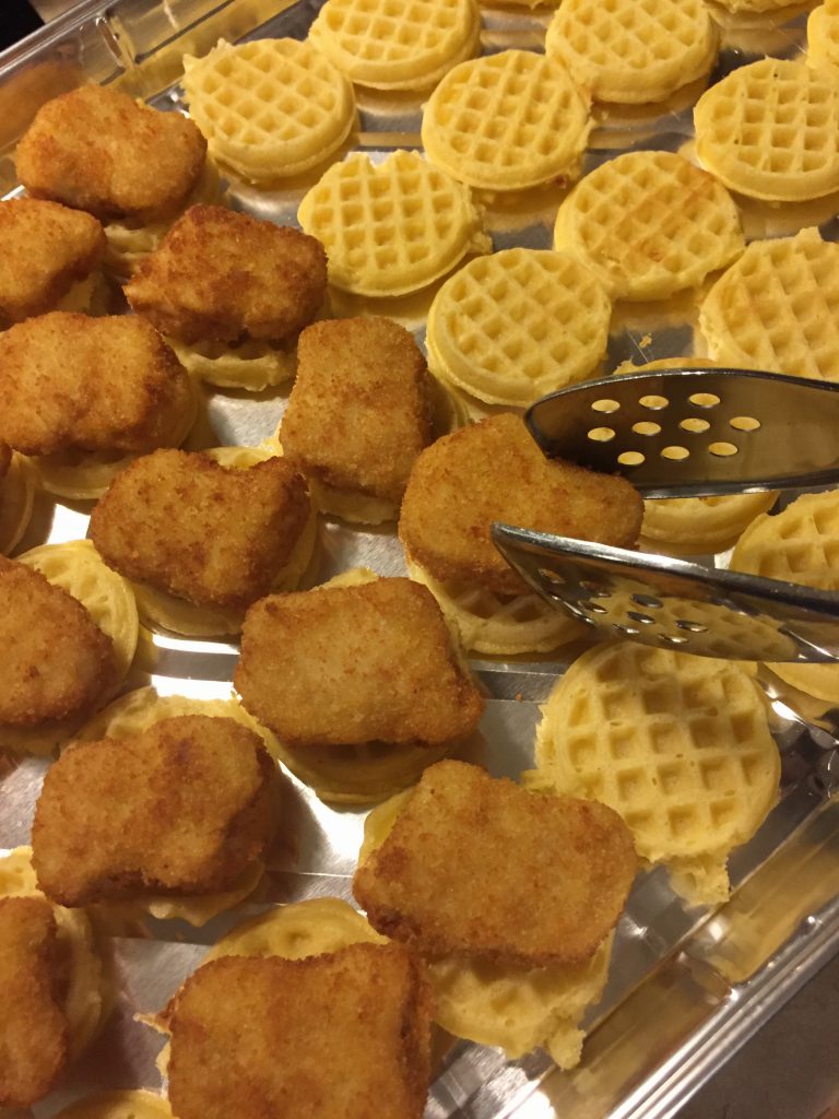 Add the chicken to each waffle.