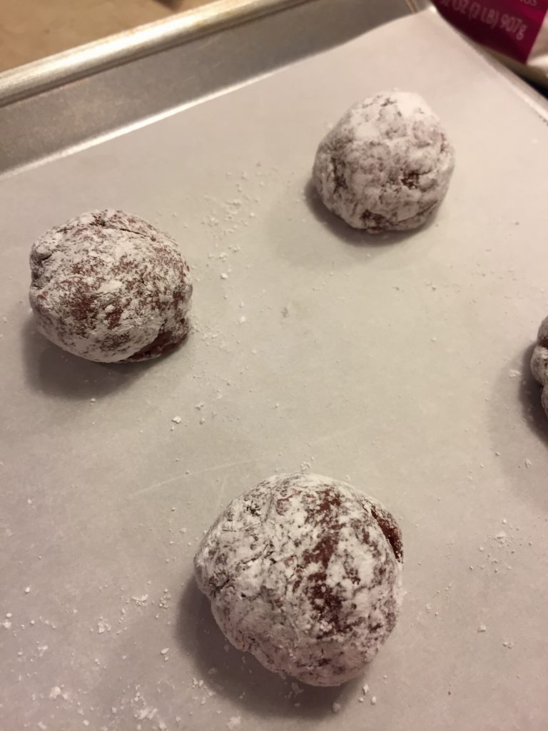 cookies rolled in powdered sugar