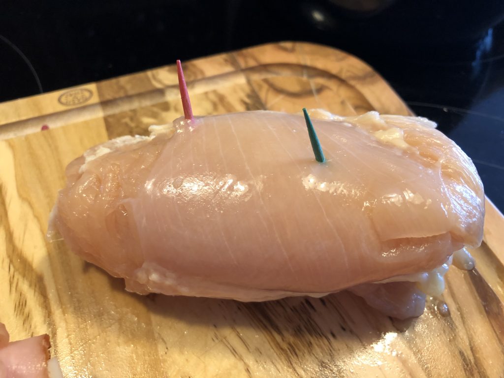 Use a toothpick to secure the chicken cordon bleu.