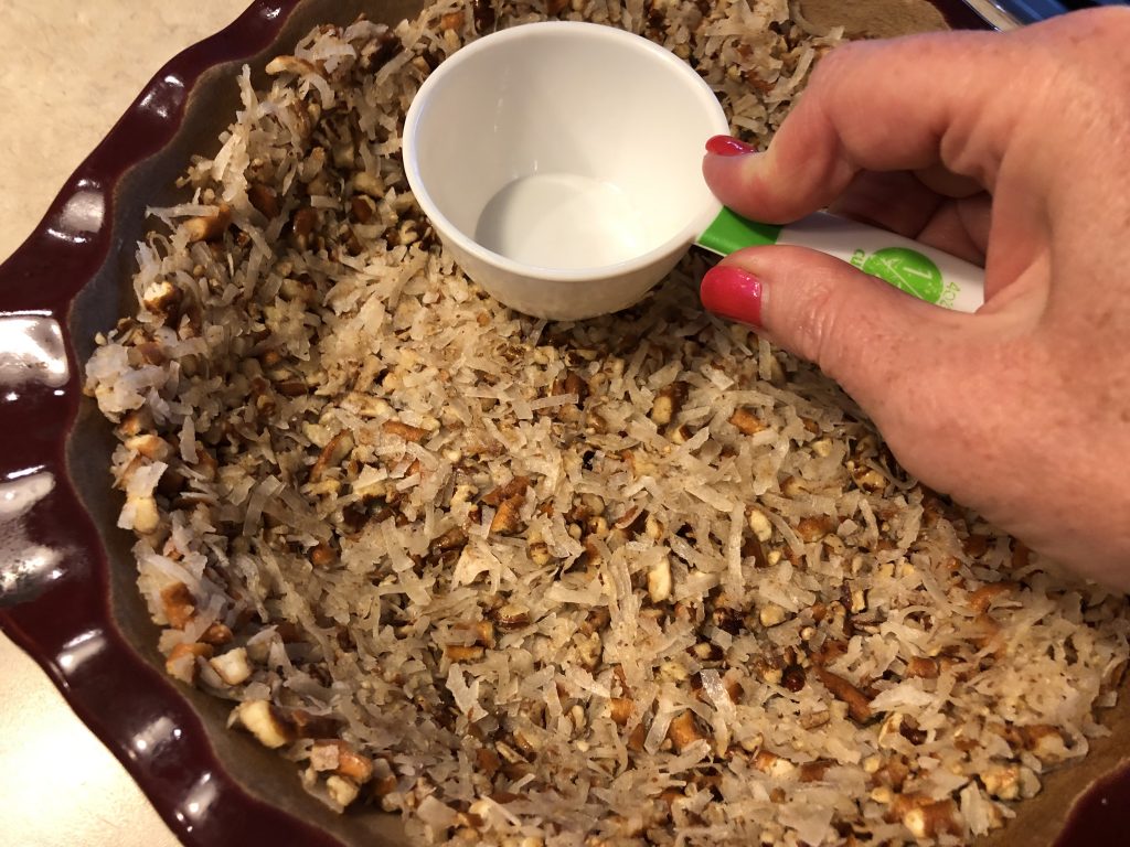 Coconut, pecans and crushed pretzels make the crunchy crust.