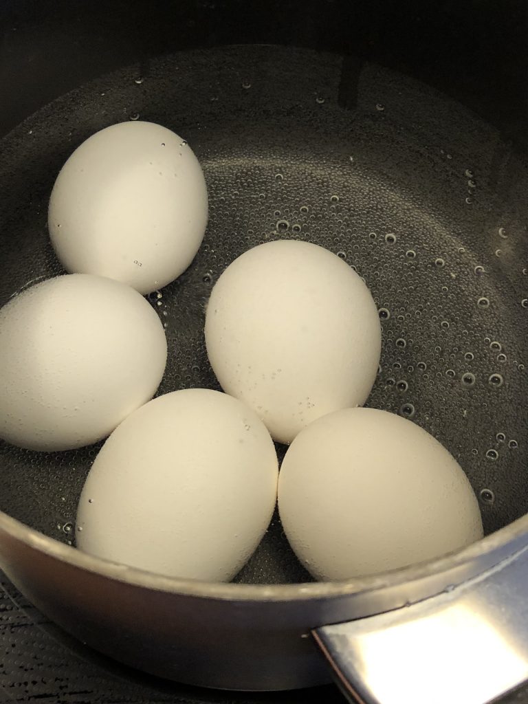 Hard boil the eggs to use for a garnish.