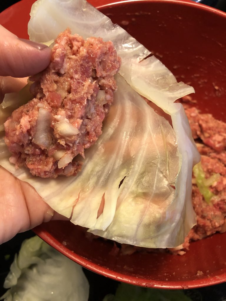 Fill cabbage leaves with meat mixure.