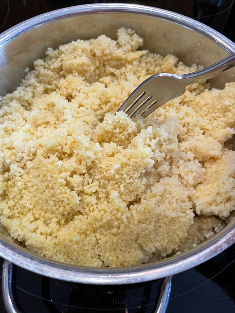 Fluff the couscous with a fork.