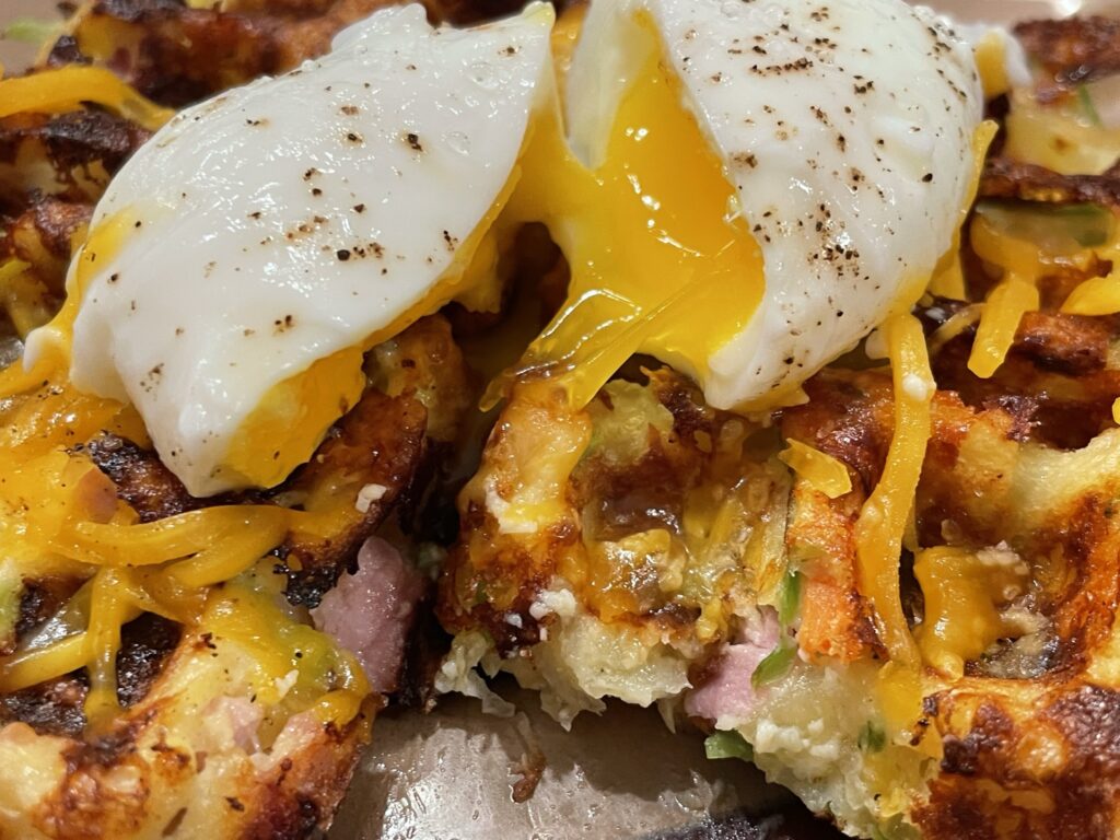 Loaded Potato Waffles with an egg on top.