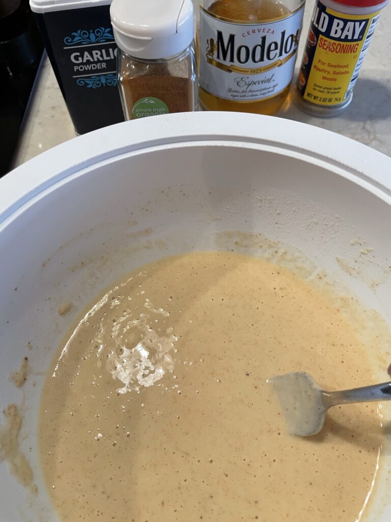 Making the beer batter for fish.