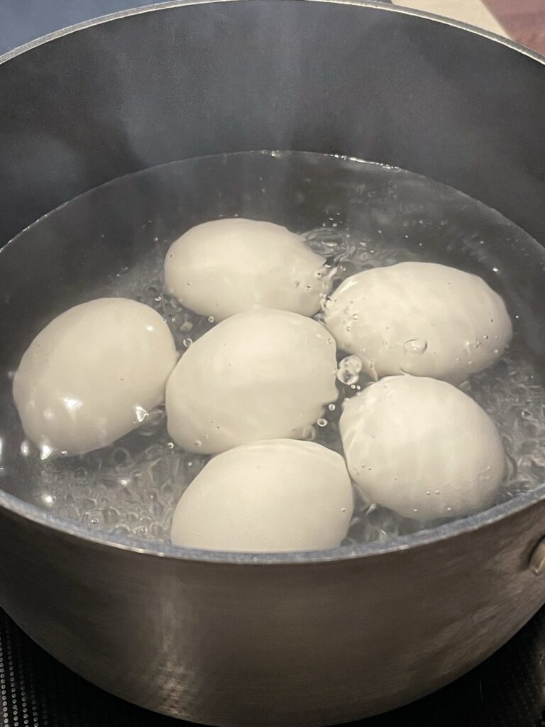 Making hard boiled eggs.