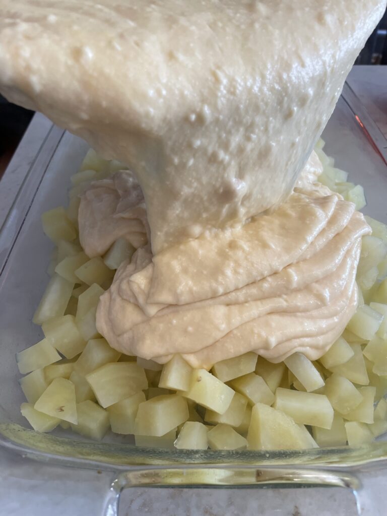 Making a creamy sauce for Cheesy Potatoes.