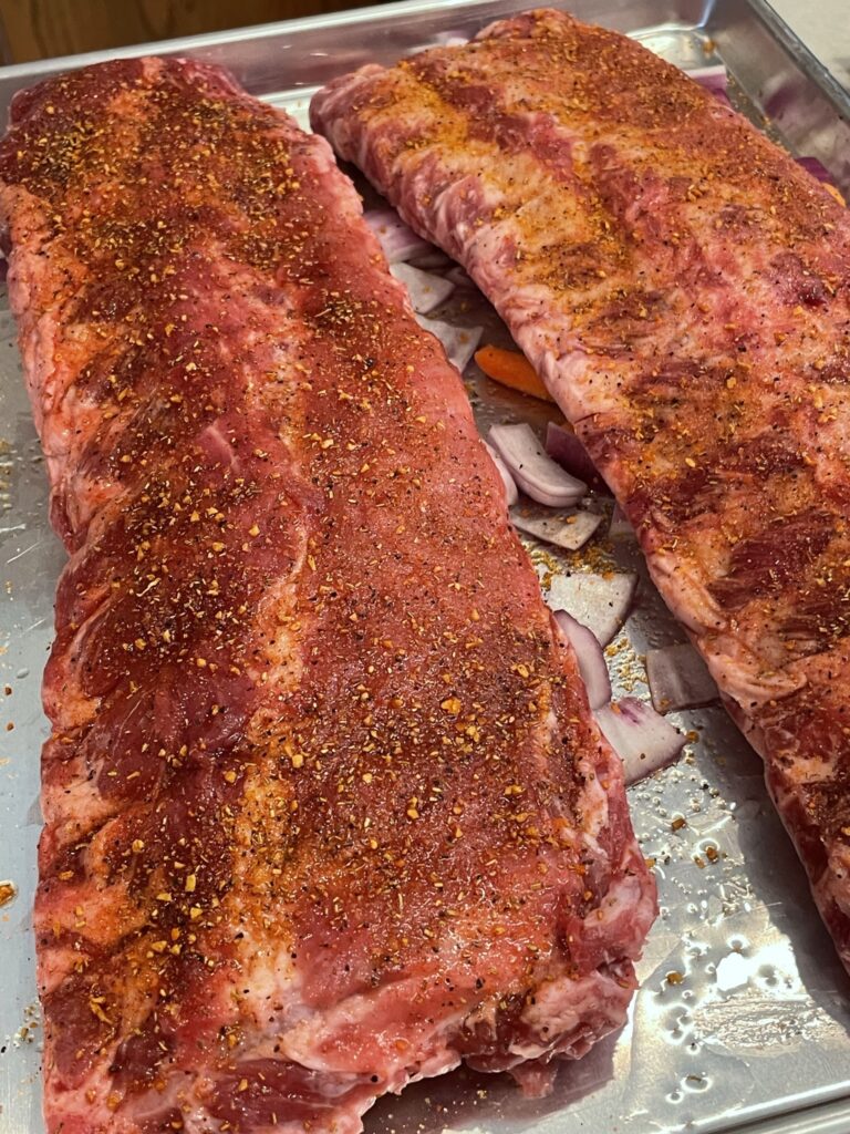 Preparing spareribs for baking.