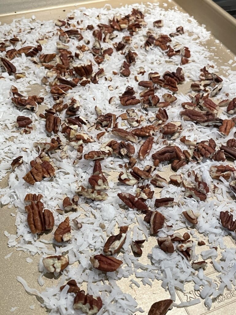 Toasting pecans and shredded coconut.