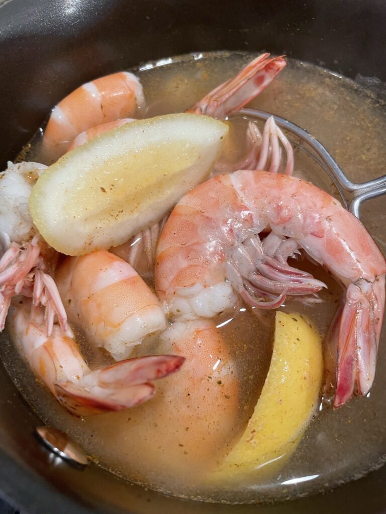 Preparing the shrimp to add to the dip.