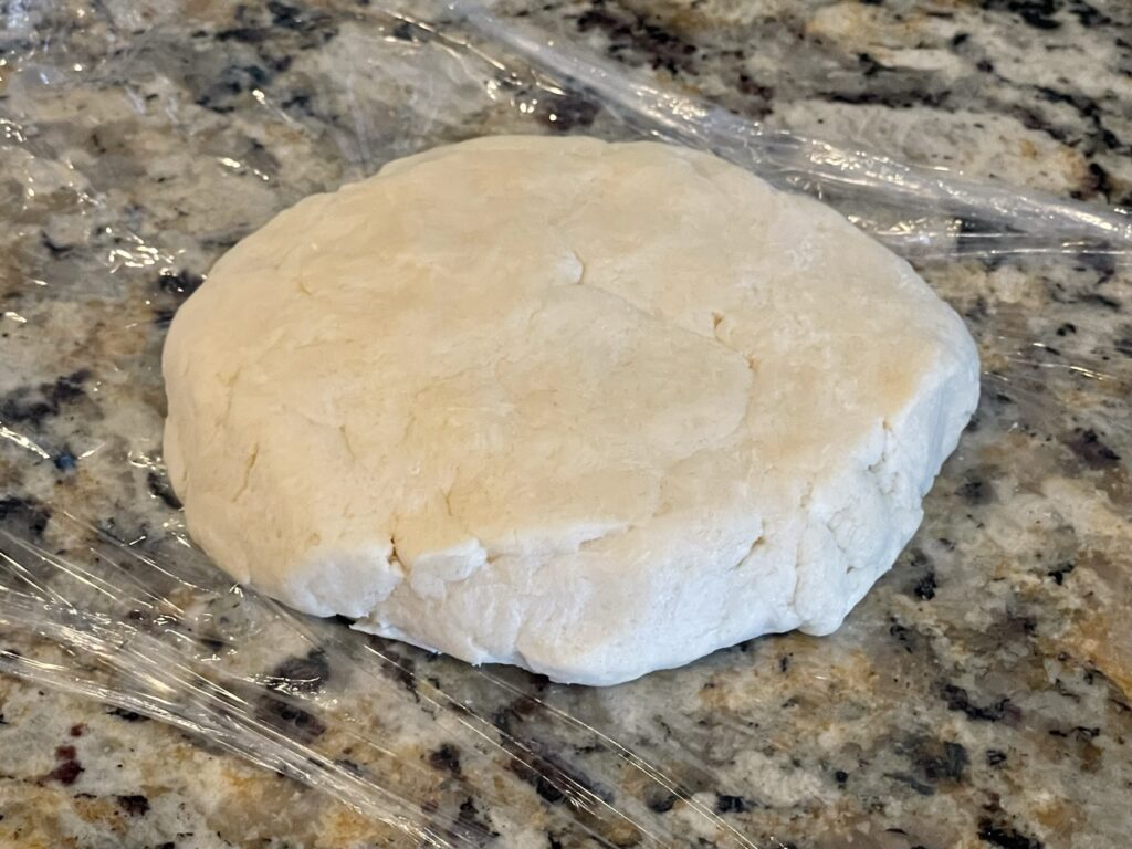 Form the pie crust into a disc before chilling in the refrigerator.