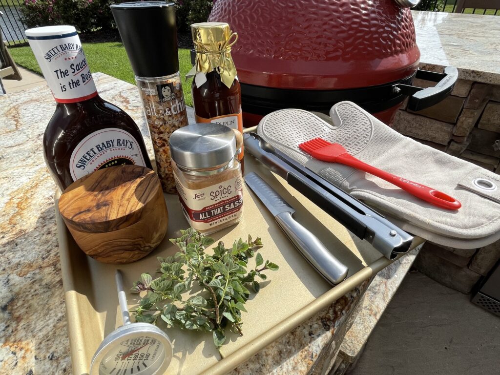 Organizing your grilling spices and tools on a baking sheet makes them easy to carry.