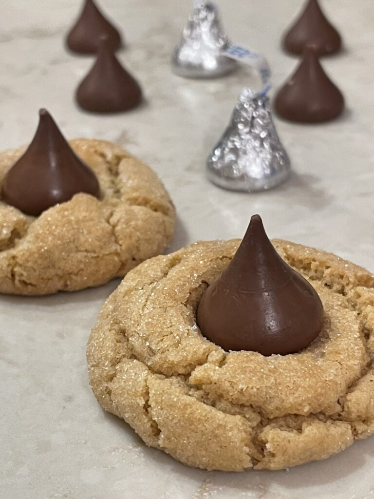 Top each cookie with a Hershey's Chocolate Kiss