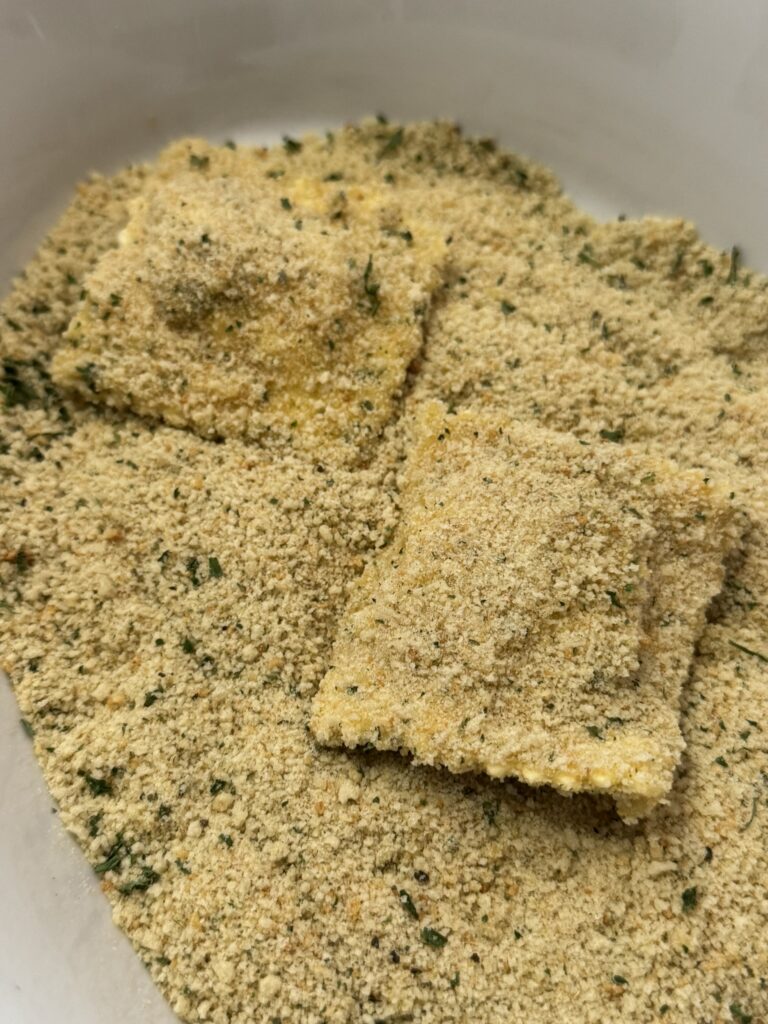 Coat the ravioli with seasoned bread crumbs.